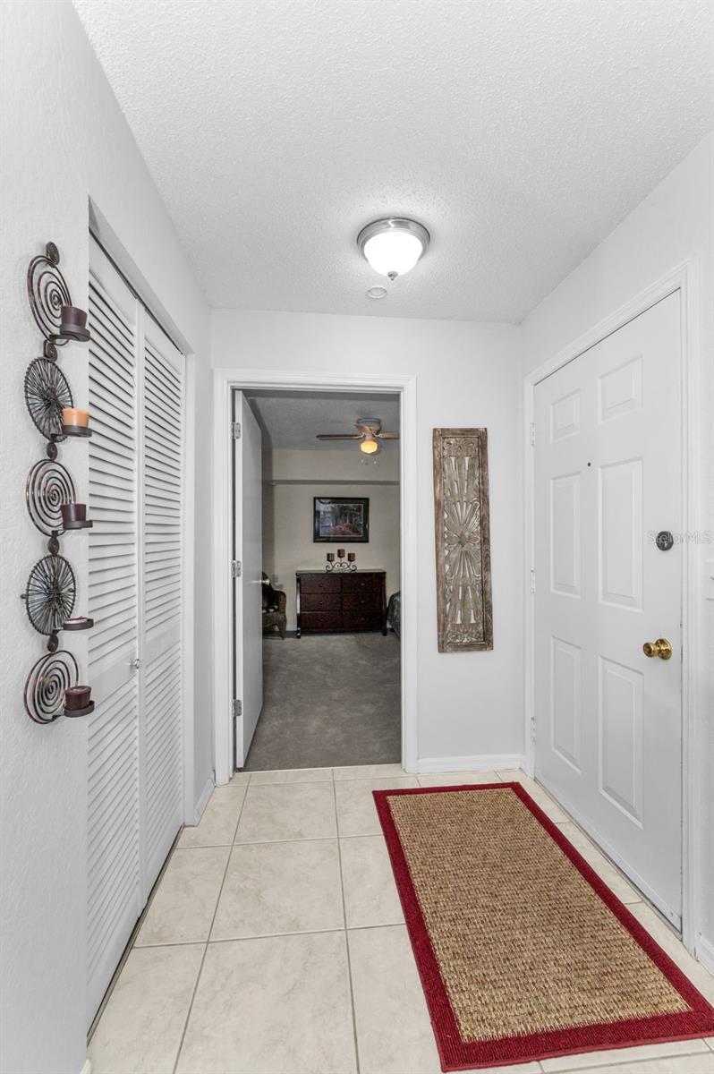 Entryway with convenient closet for shoes and jacket.