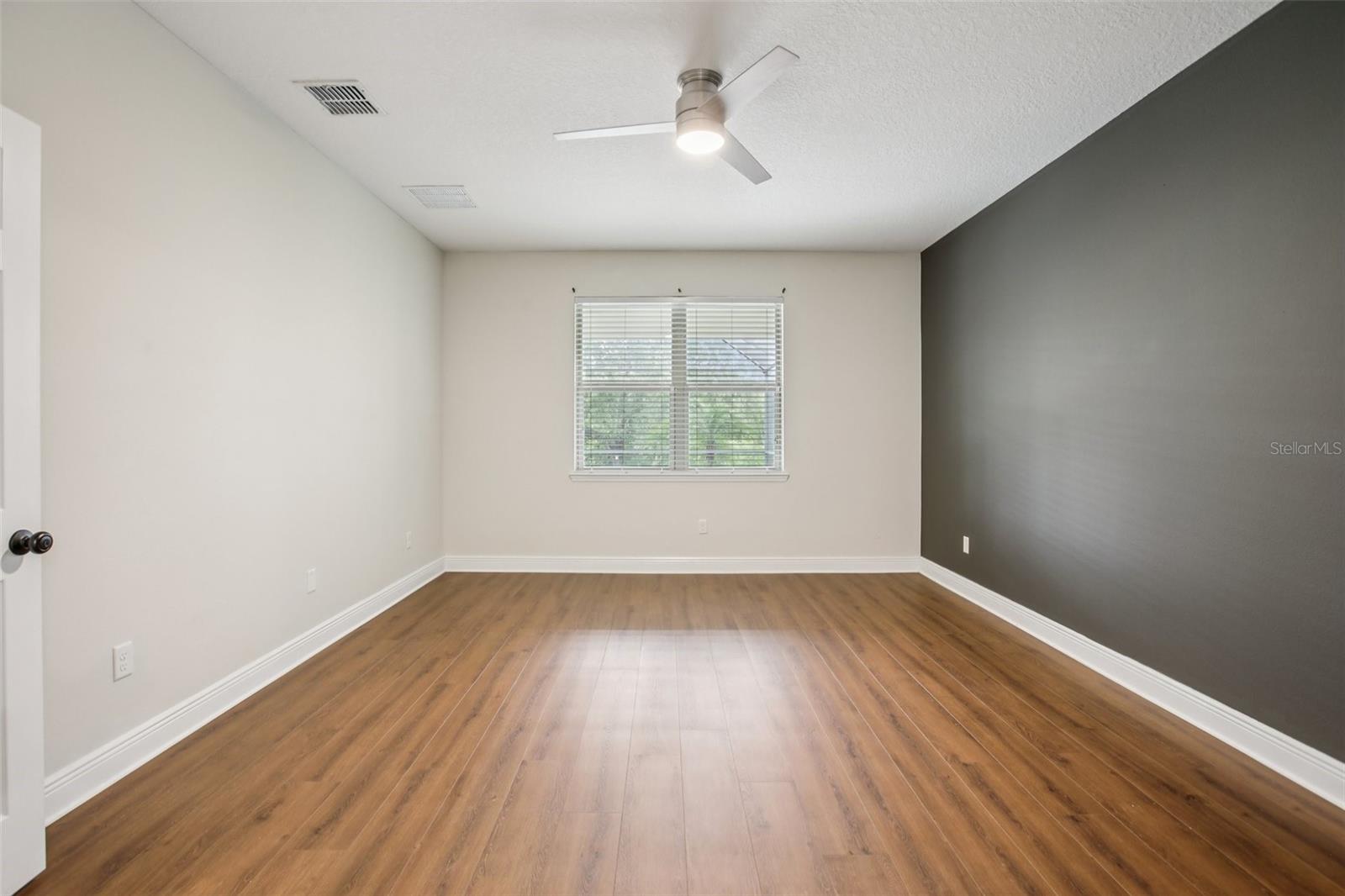 Bright bedroom with modern flooring