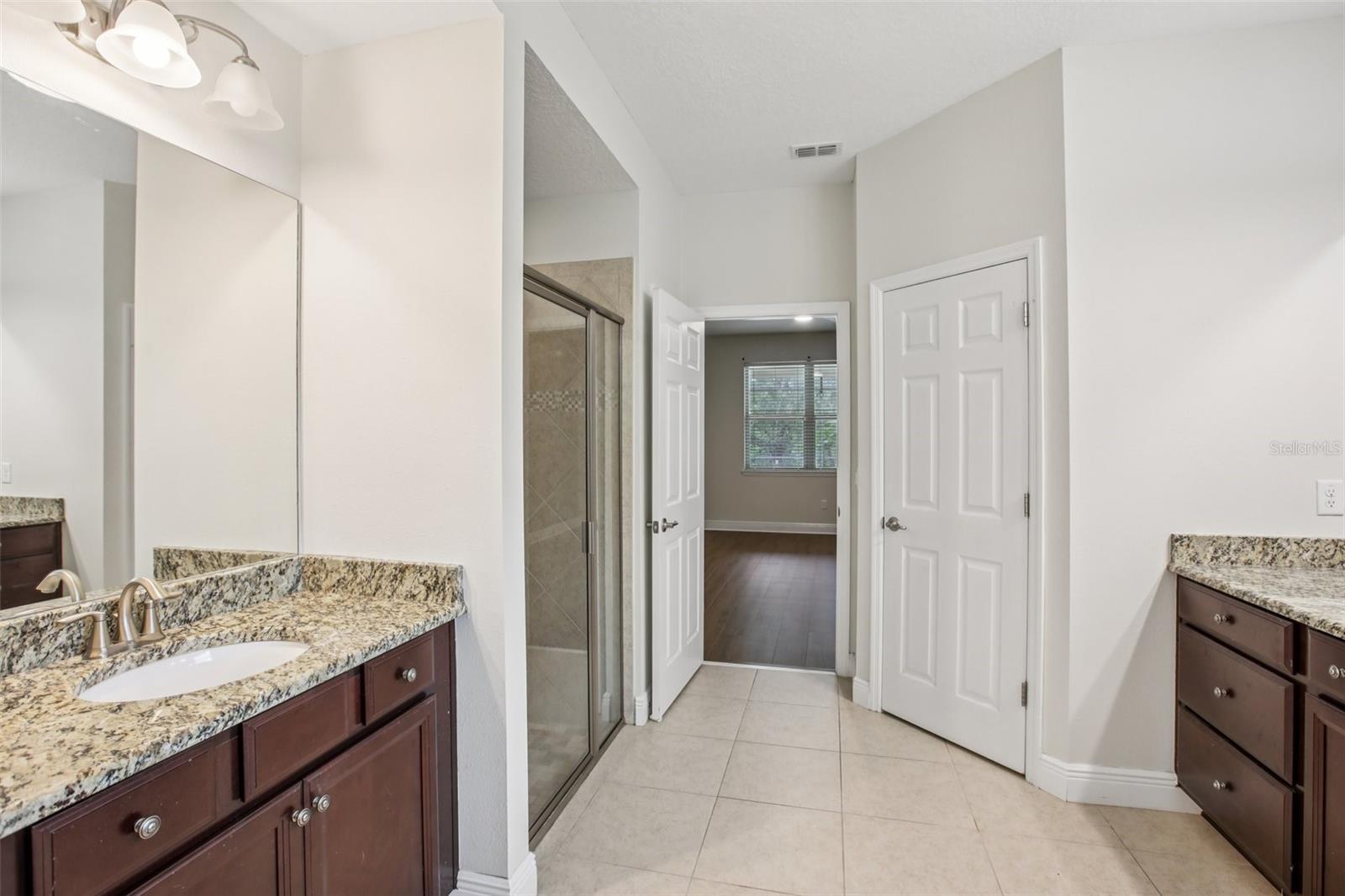 Primary bath with granite vanities
