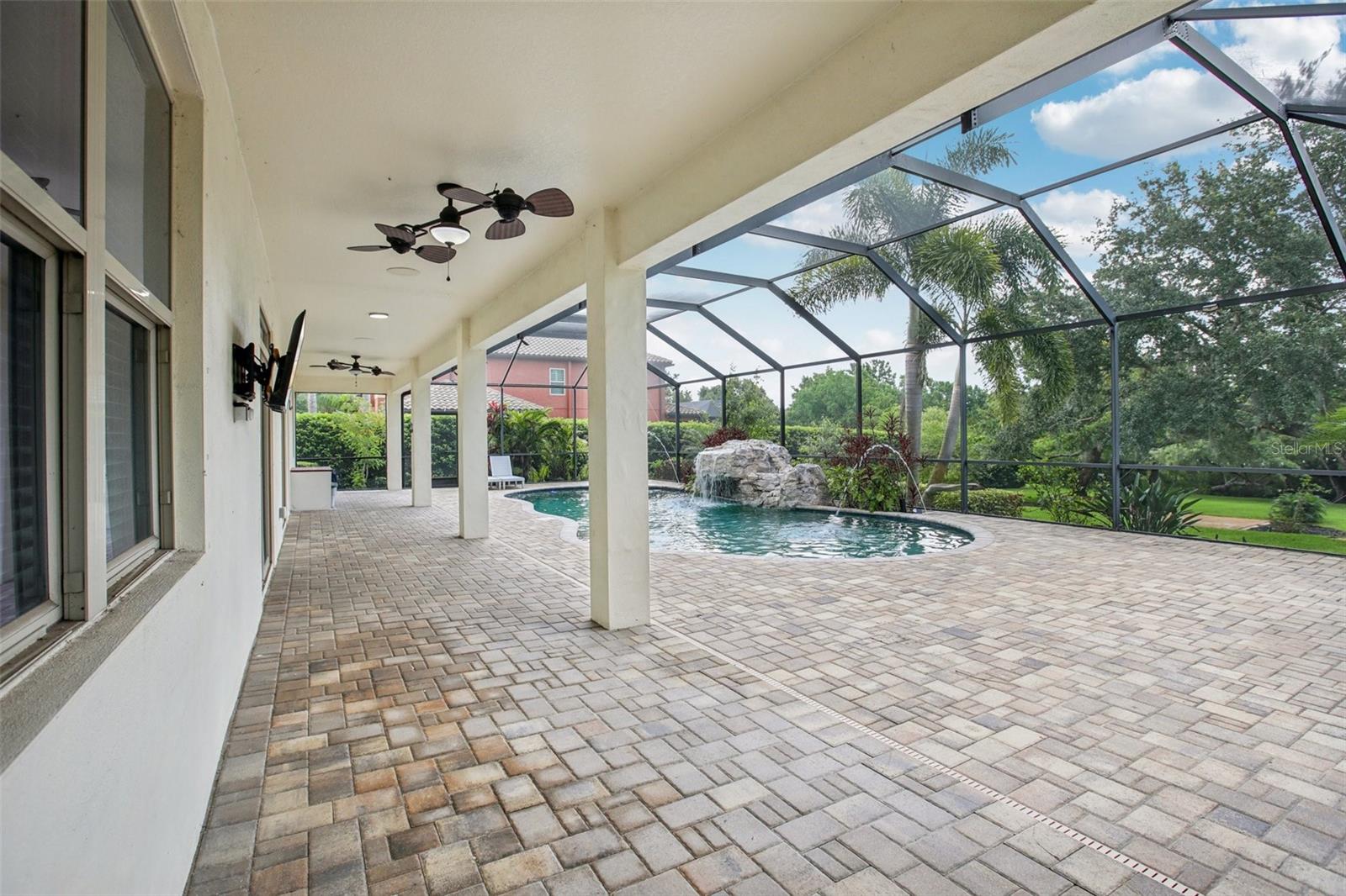 Expansive lanai with resort-style pool.