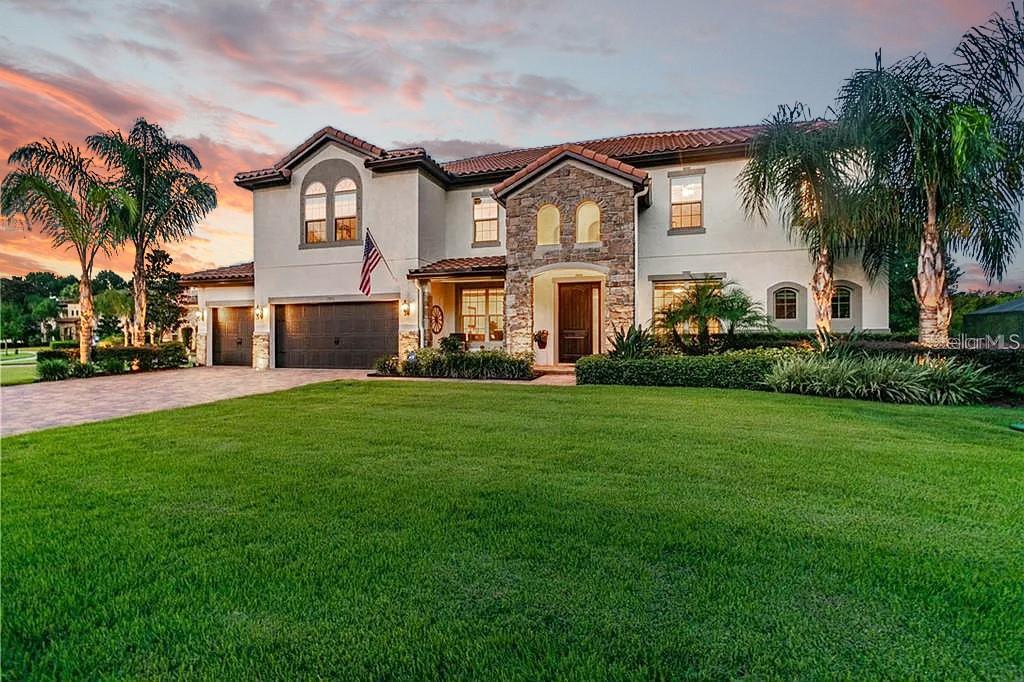 Twilight curb appeal with lush landscaping