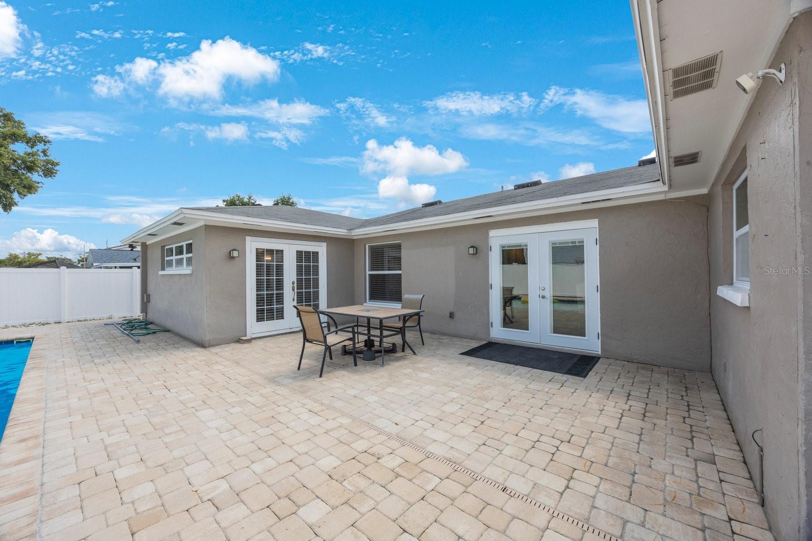 2 French doors open to the back patio