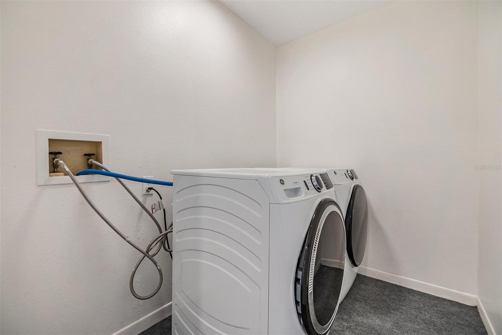 Laundry room with full sized washer and dryer.