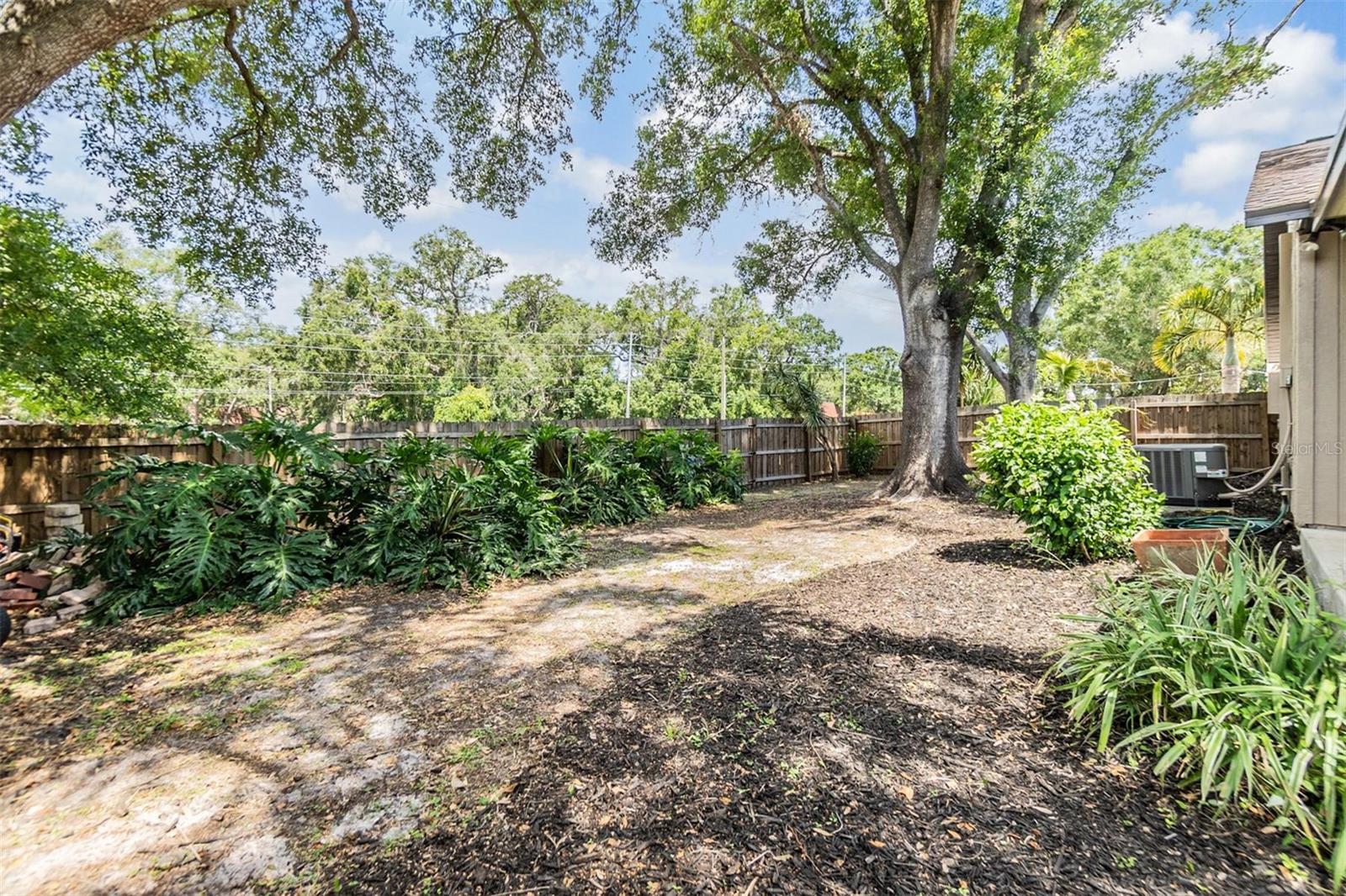Plenty of room for gardening, and children to play. Also pet friendly with doggie door and the back yard fence can be extended further back toward the road.