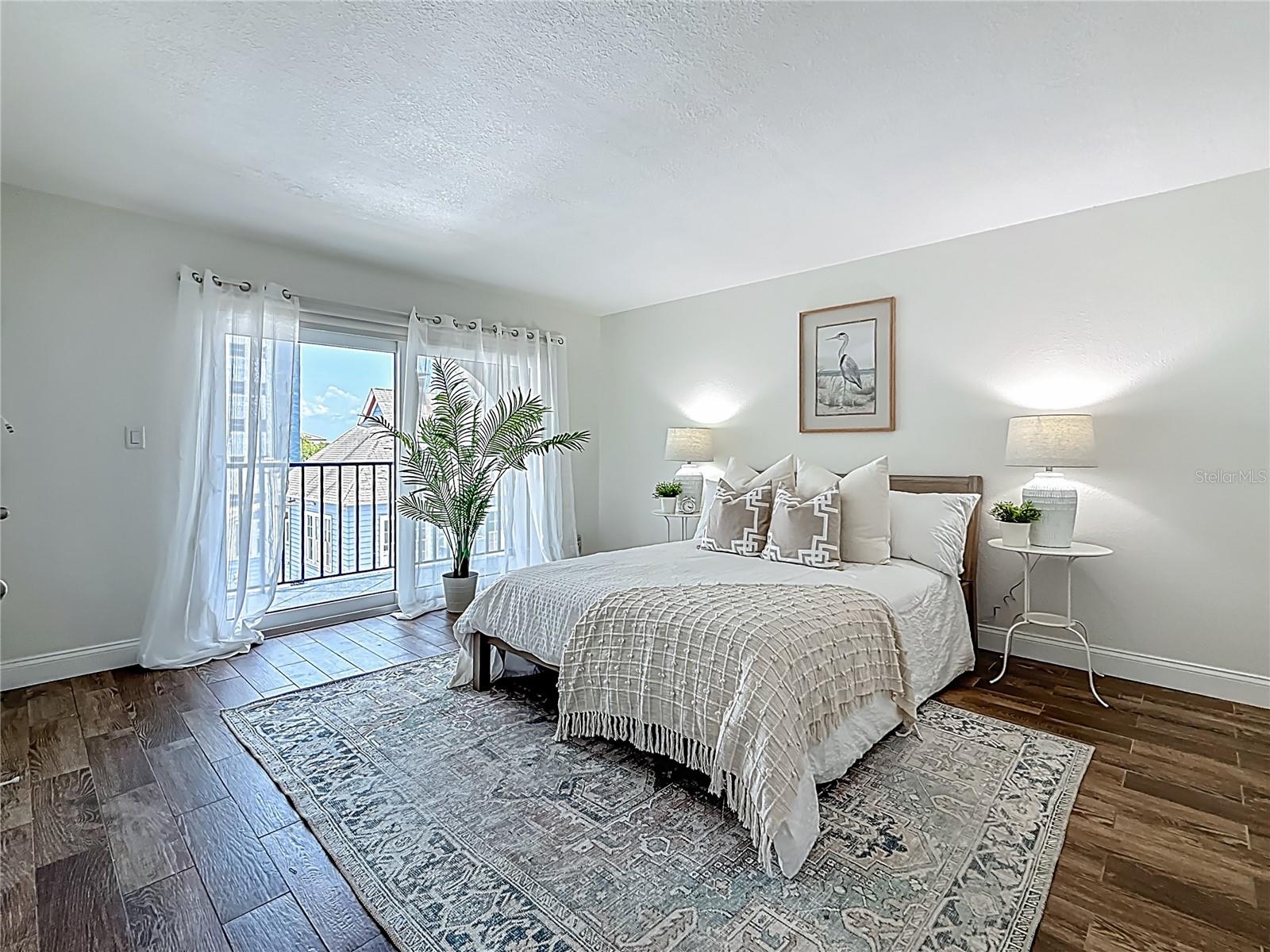The spacious primary bedroom has a 4x12 balcony.