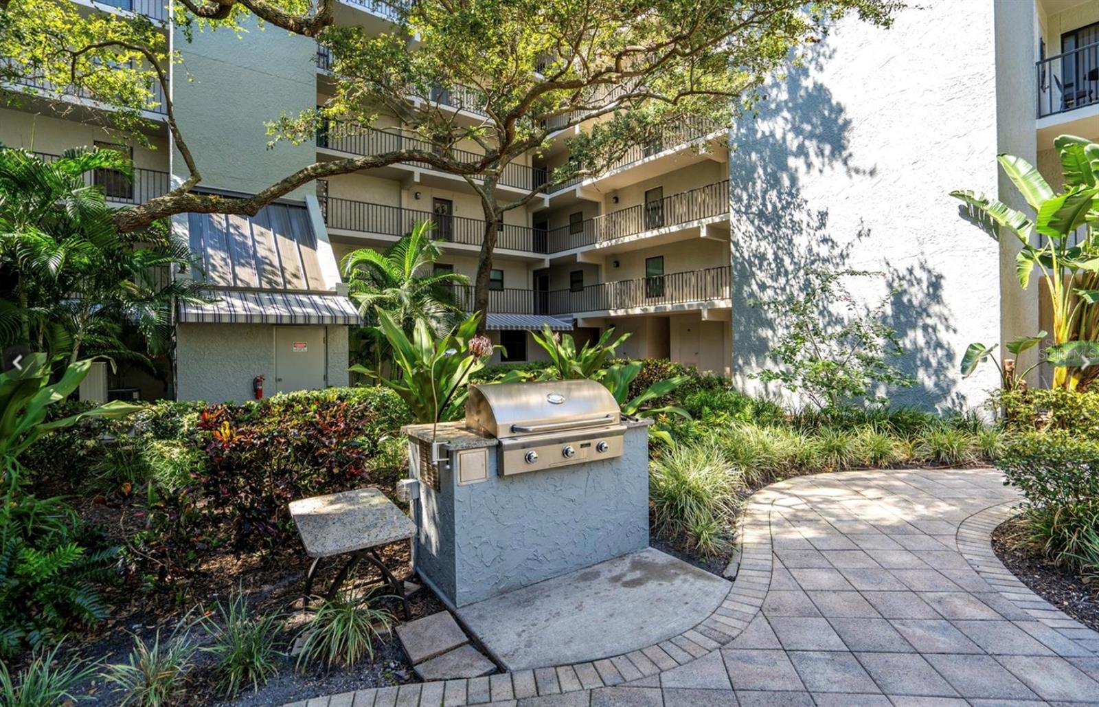 A large gas grill is perfect for pool-side dinners with family and friends.