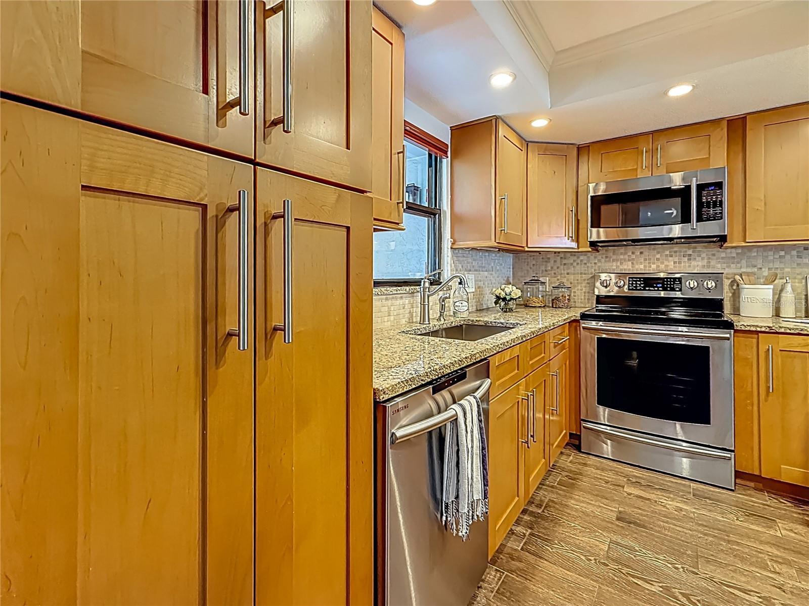 The remodeled kitchen provides excellent storage space with a built in closet pantry and  lazy-susan corner storage.