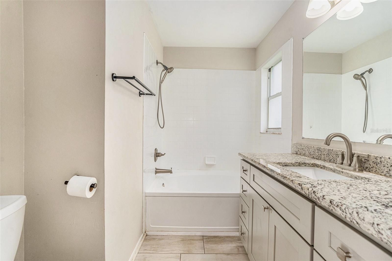 En suite - single vanity- granite countertops