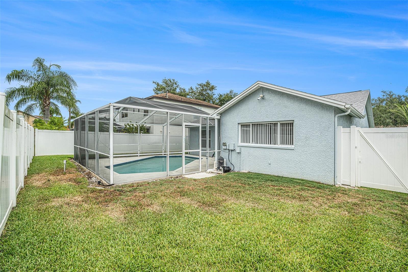 Fenced yard with inground pool