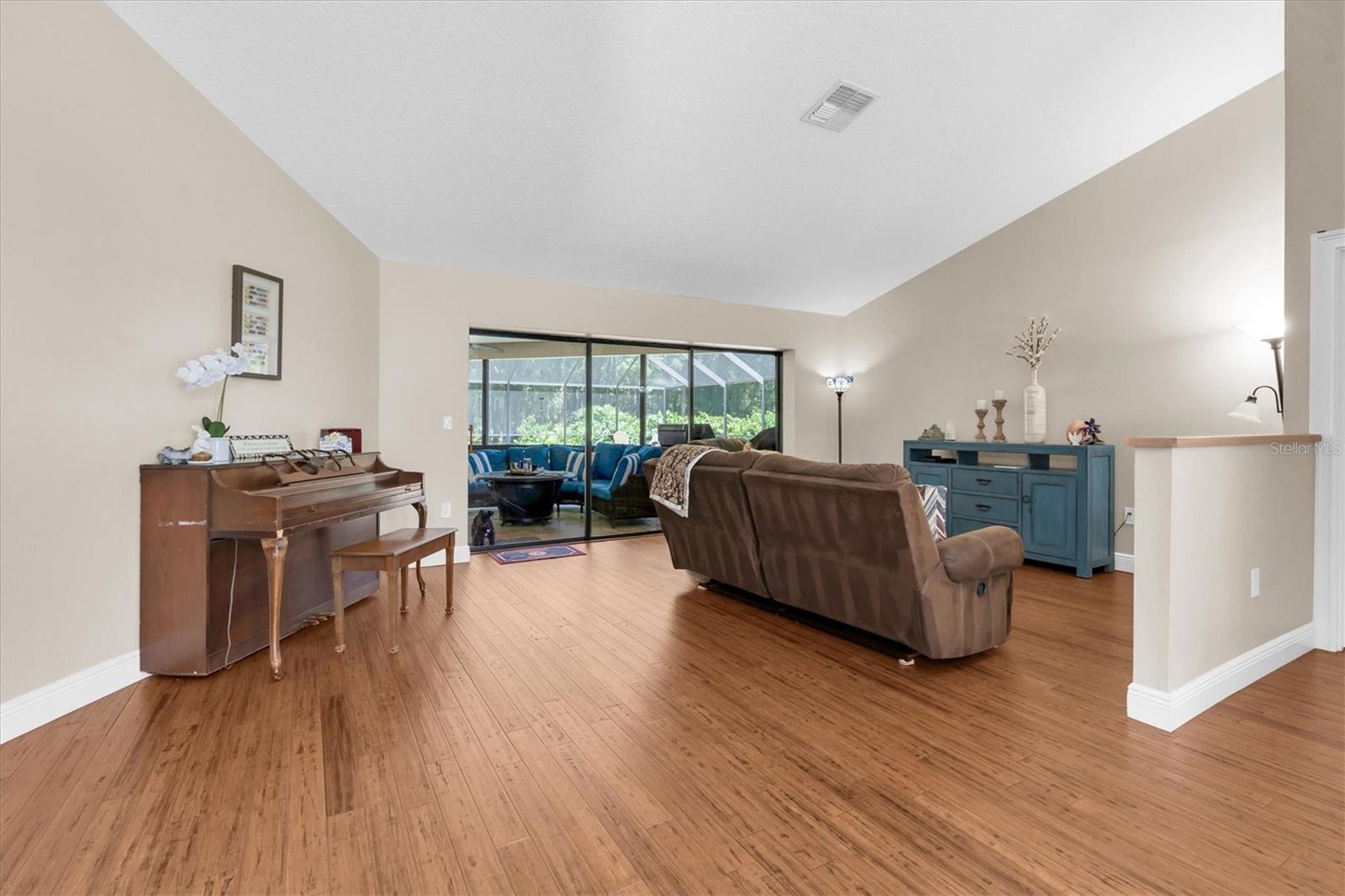 Family Room with pool views and wood floors
