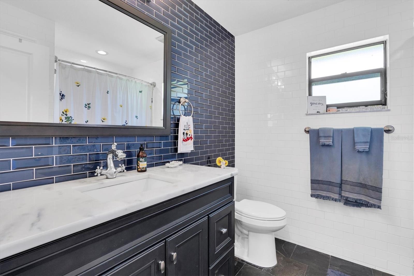 Hall Bath with custom tile and tub/shower
