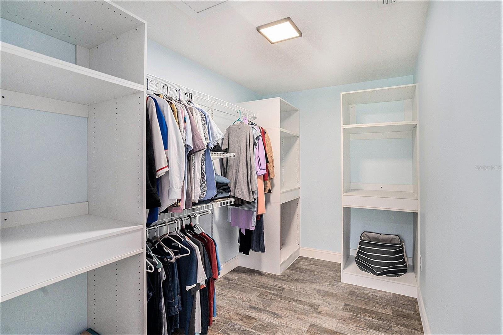 Huge walk-in closet with custom shelving that can be further customized to your liking
