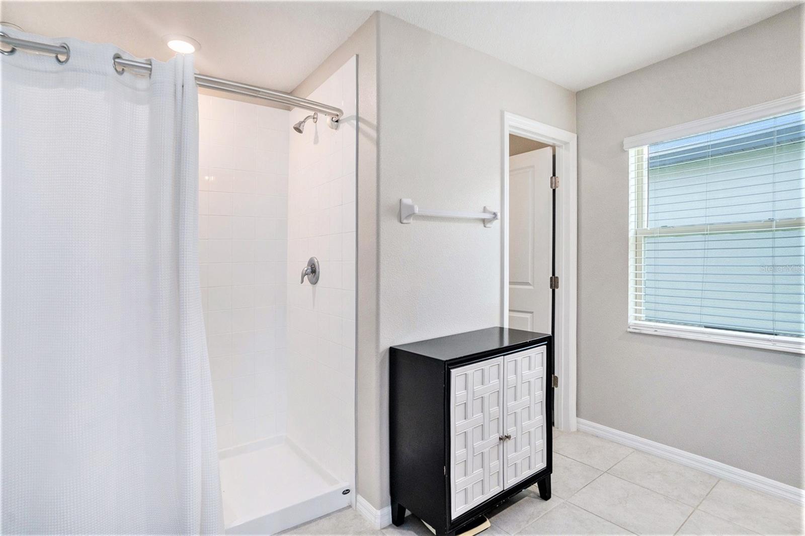 Walk-in shower in the master bedroom