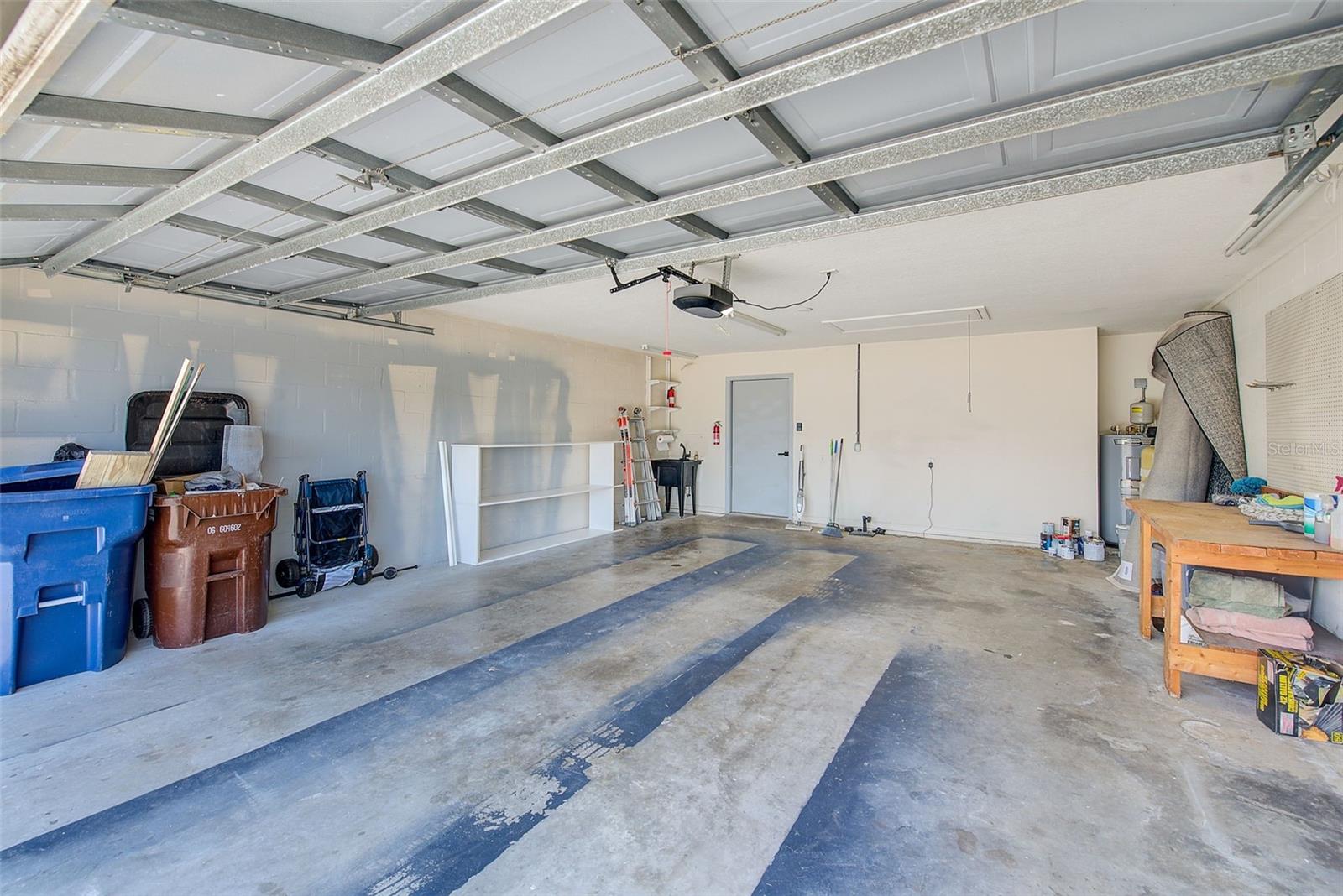 2 CAR GARAGE WIRED FOR ELECTRIC VEHICLE & BUILT IN WORK BENCH