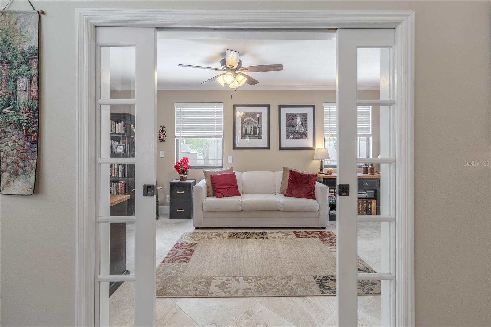 Thoughtfully positioned just off the main living area, the Florida room provides a quiet retreat with privacy and charm, making it a standout feature for those working from home or seeking a relaxing getaway within the home.