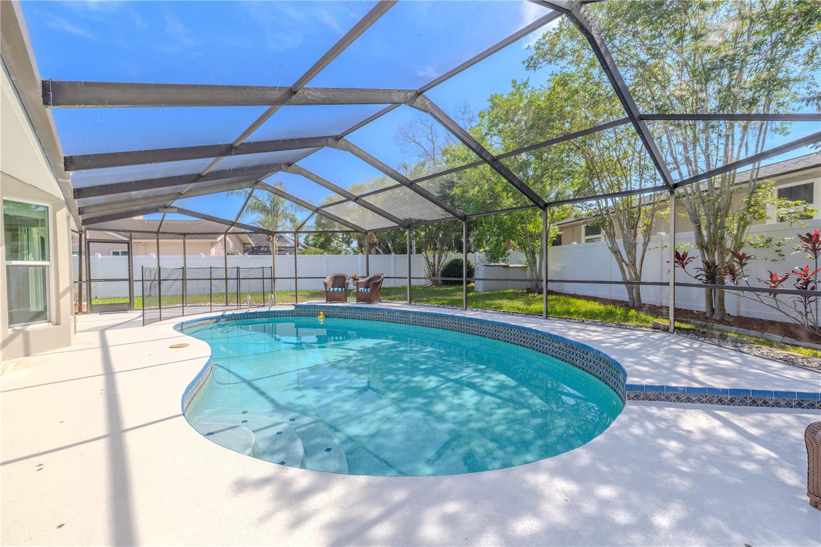 A private backyard retreat, where a sparkling heated in-ground pool becomes the centerpiece of your outdoor lifestyle.