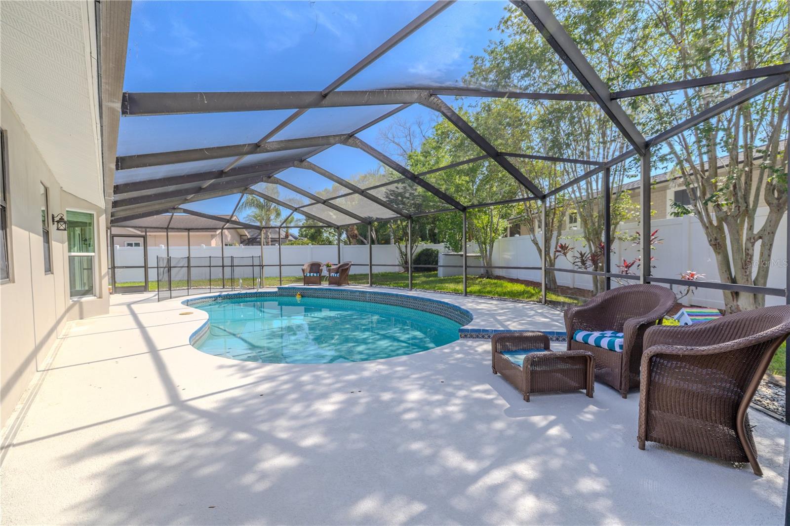 Fully screened for protection from the elements while still letting in the warm Florida sunshine.