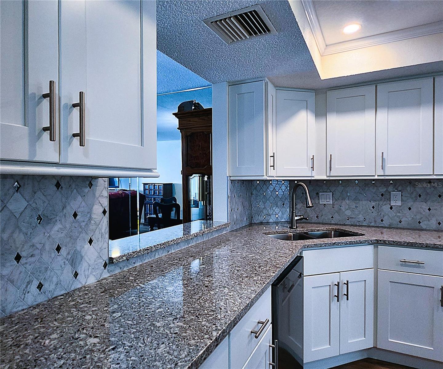 Kitchen: all featured appliances included, soft close cabinets, garbage disposal, granite countertop & stone backsplash