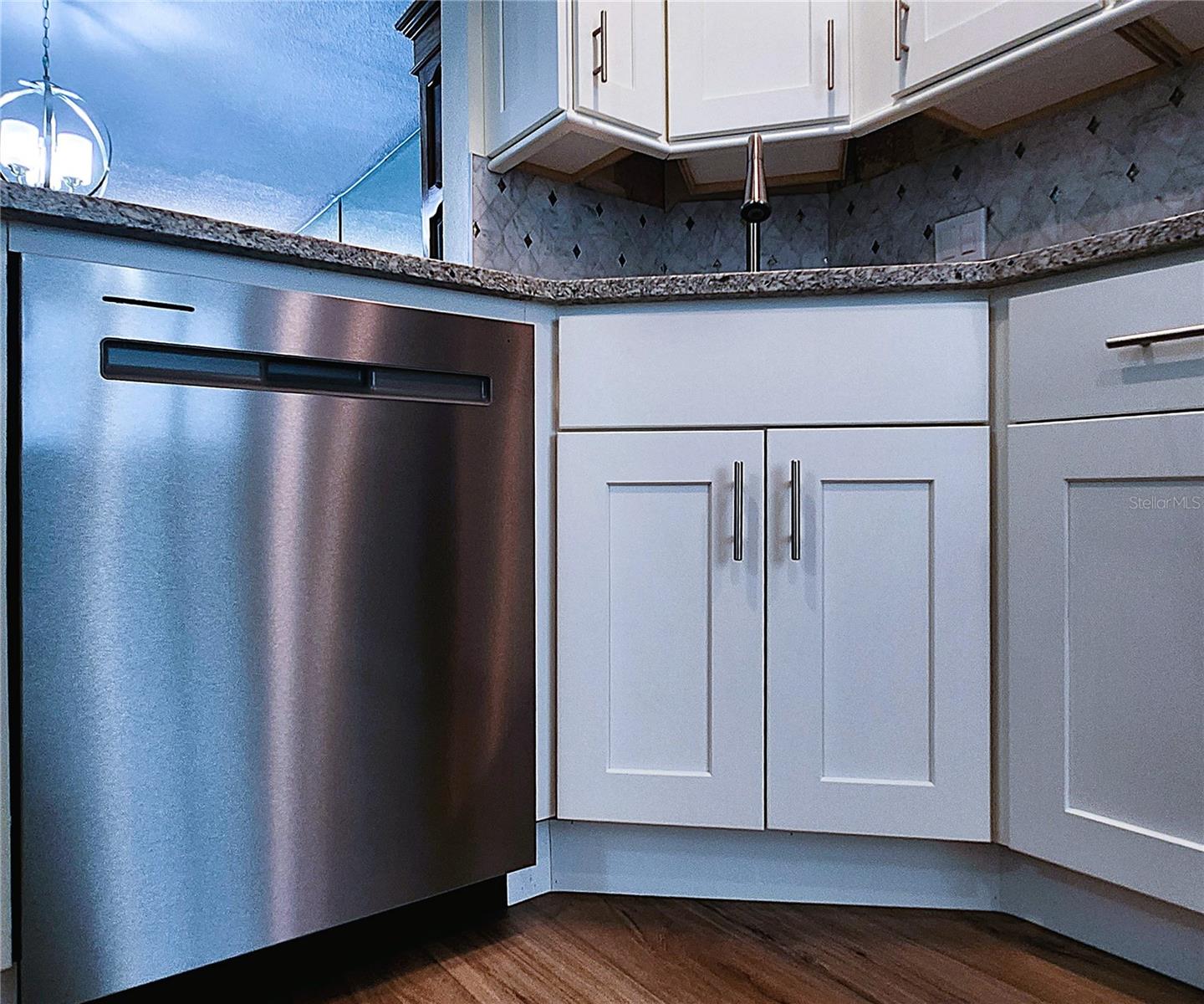 Kitchen: all featured appliances included, soft close cabinets, garbage disposal, granite countertop & stone backsplash