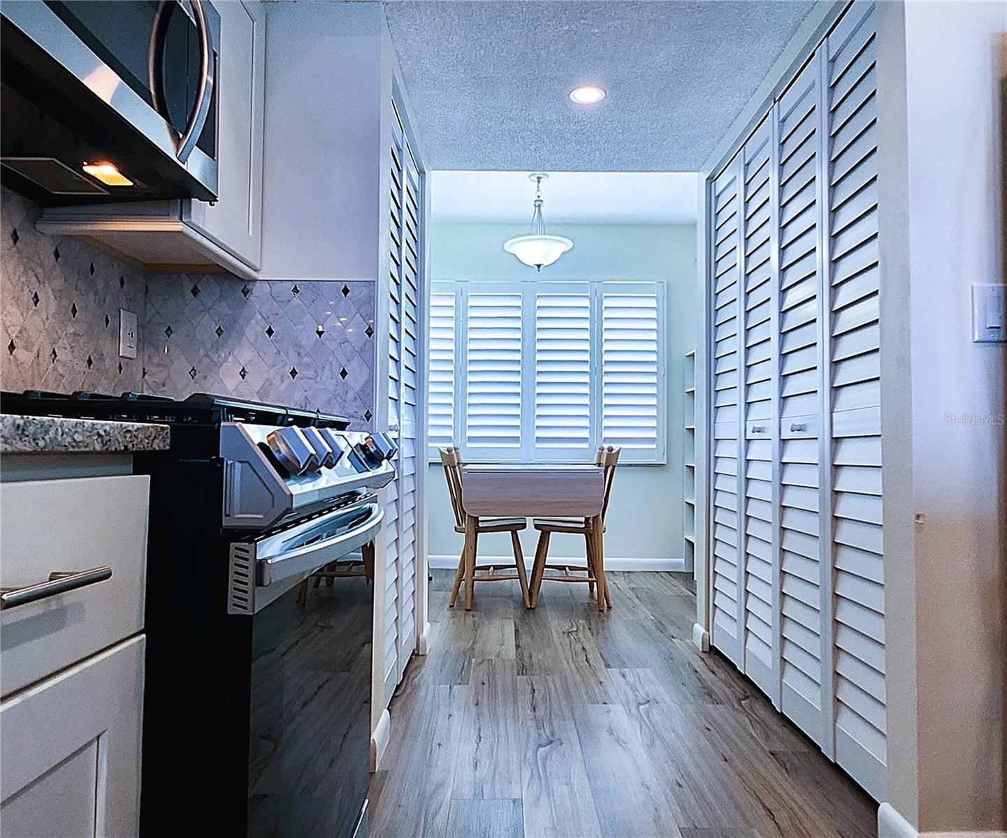 Kitchen: all featured appliances included, soft close cabinets, garbage disposal, granite countertop & stone backsplash