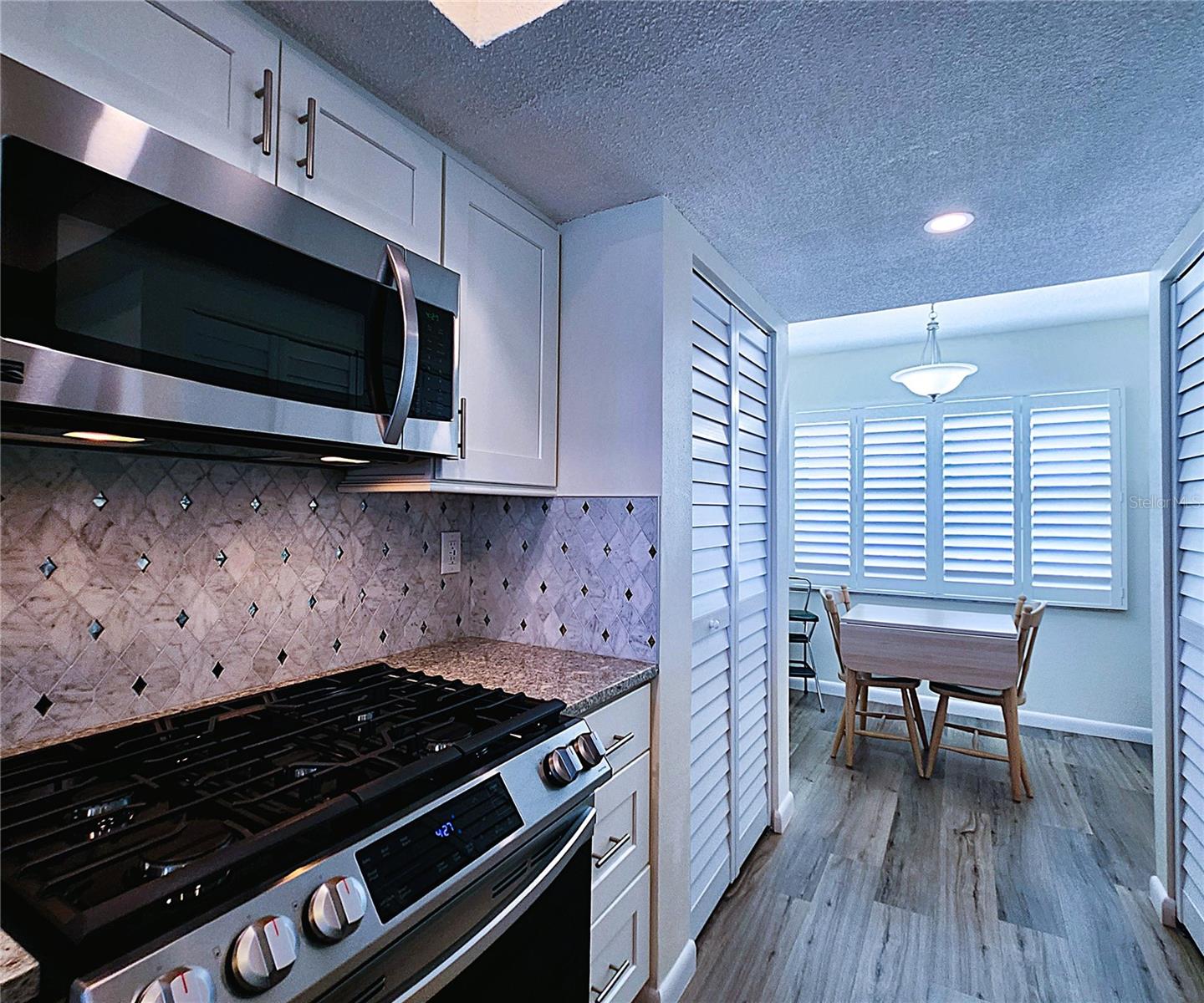 Kitchen: all featured appliances included, soft close cabinets, garbage disposal, granite countertop & stone backsplash