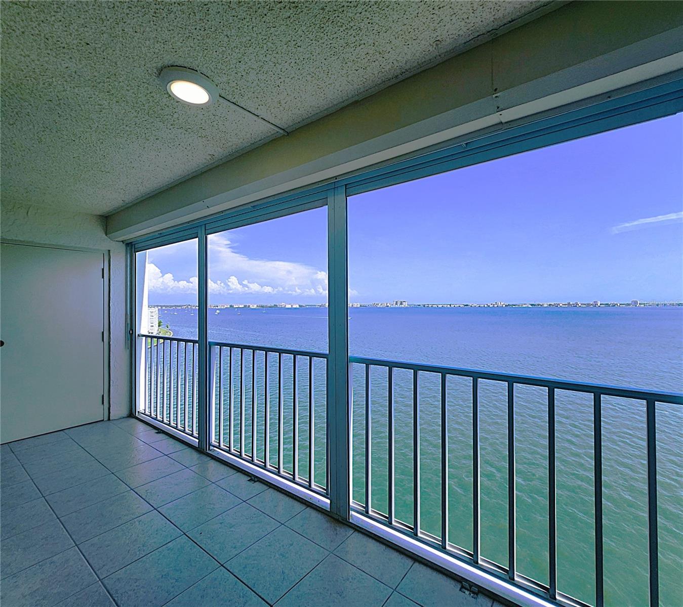 Balcony includes Hurricane Shutters, Lighting, Ceramic Tiled Floor, and Storage Room