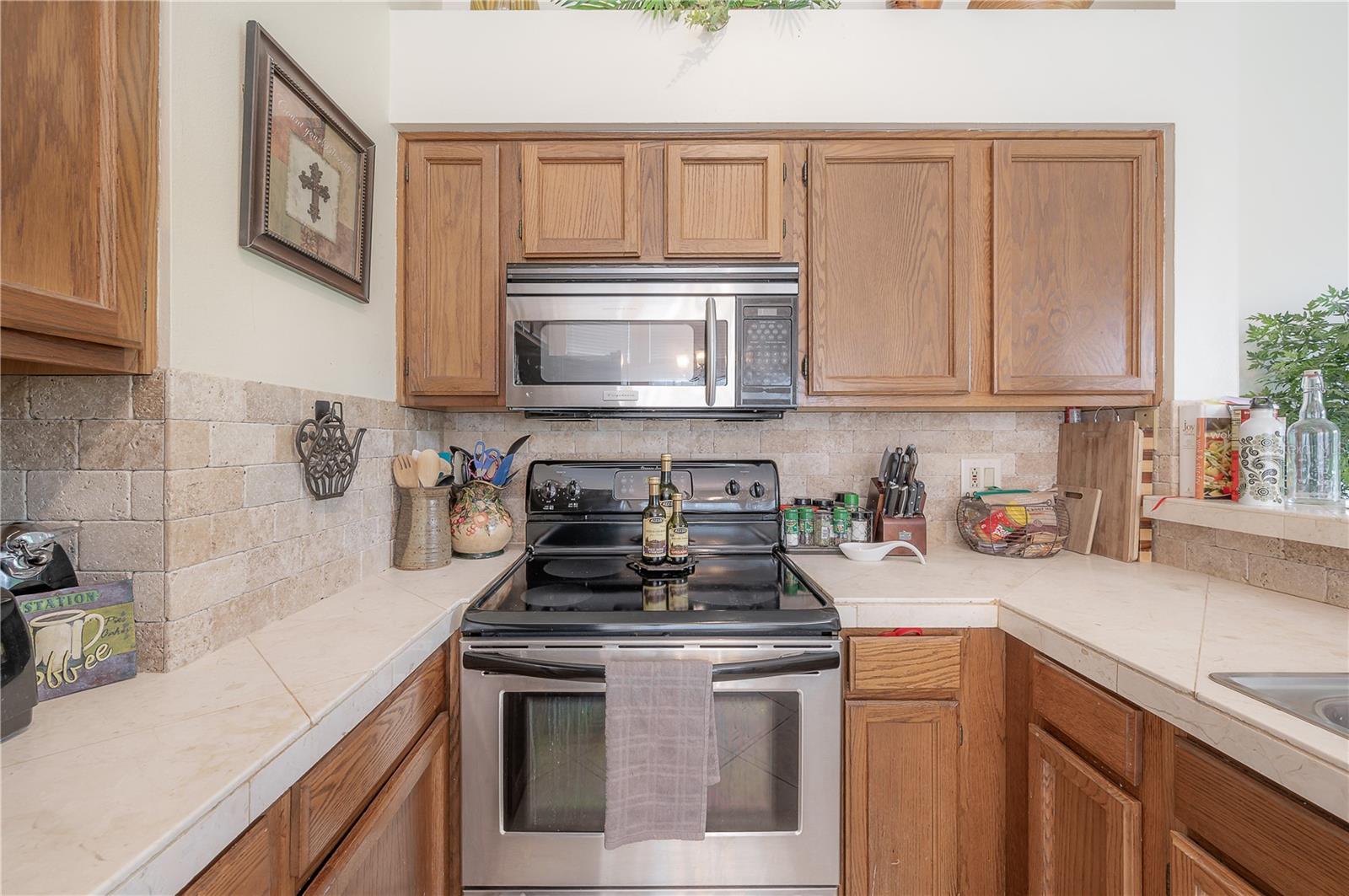 Kitchen with wood cabinets and stainless steel appliances