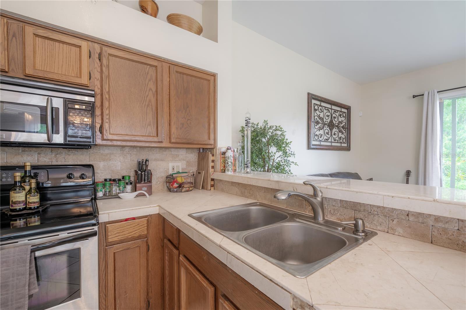 Kitchen with wood cabinets and stainless steel appliances