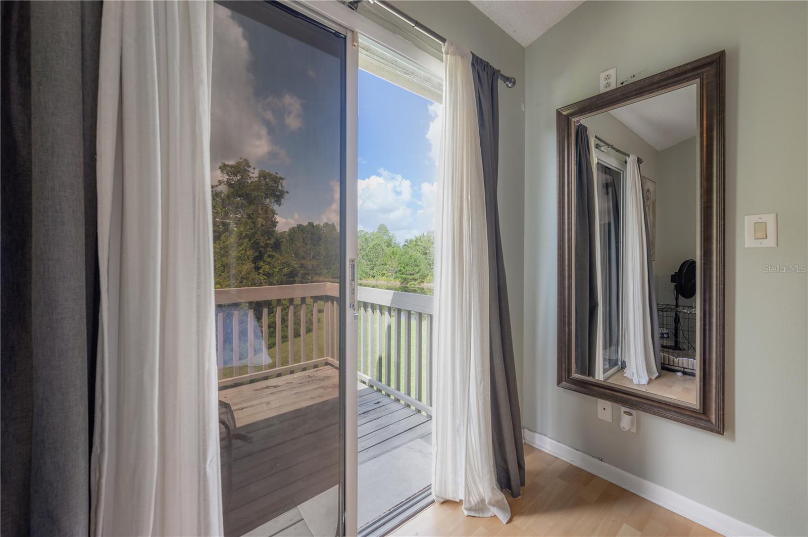 Sliding doors from the primary suite lead out to the upper deck