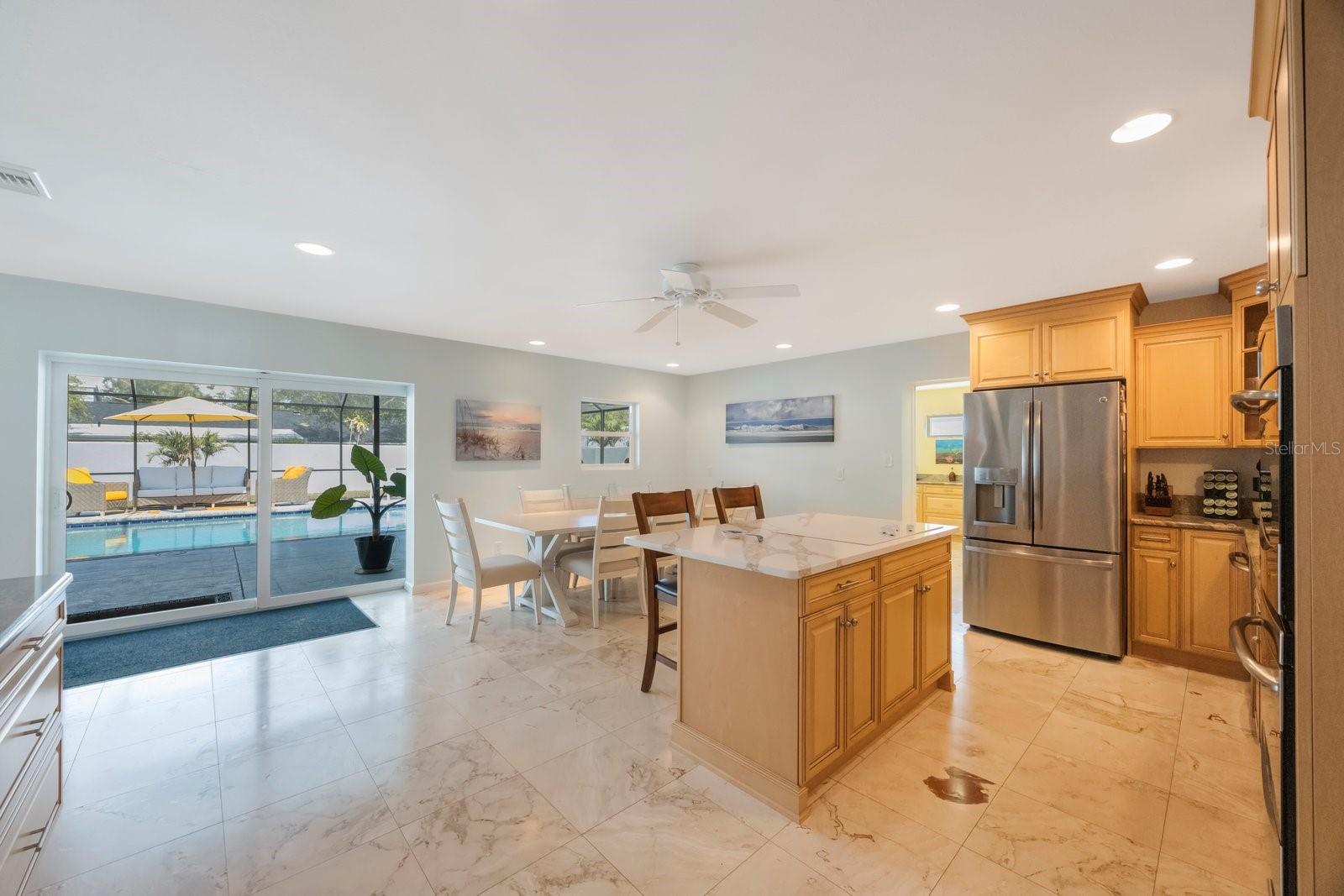 Step through the expansive sliding glass doors and seamlessly transition into your own private resort area, where relaxation and outdoor living await,
