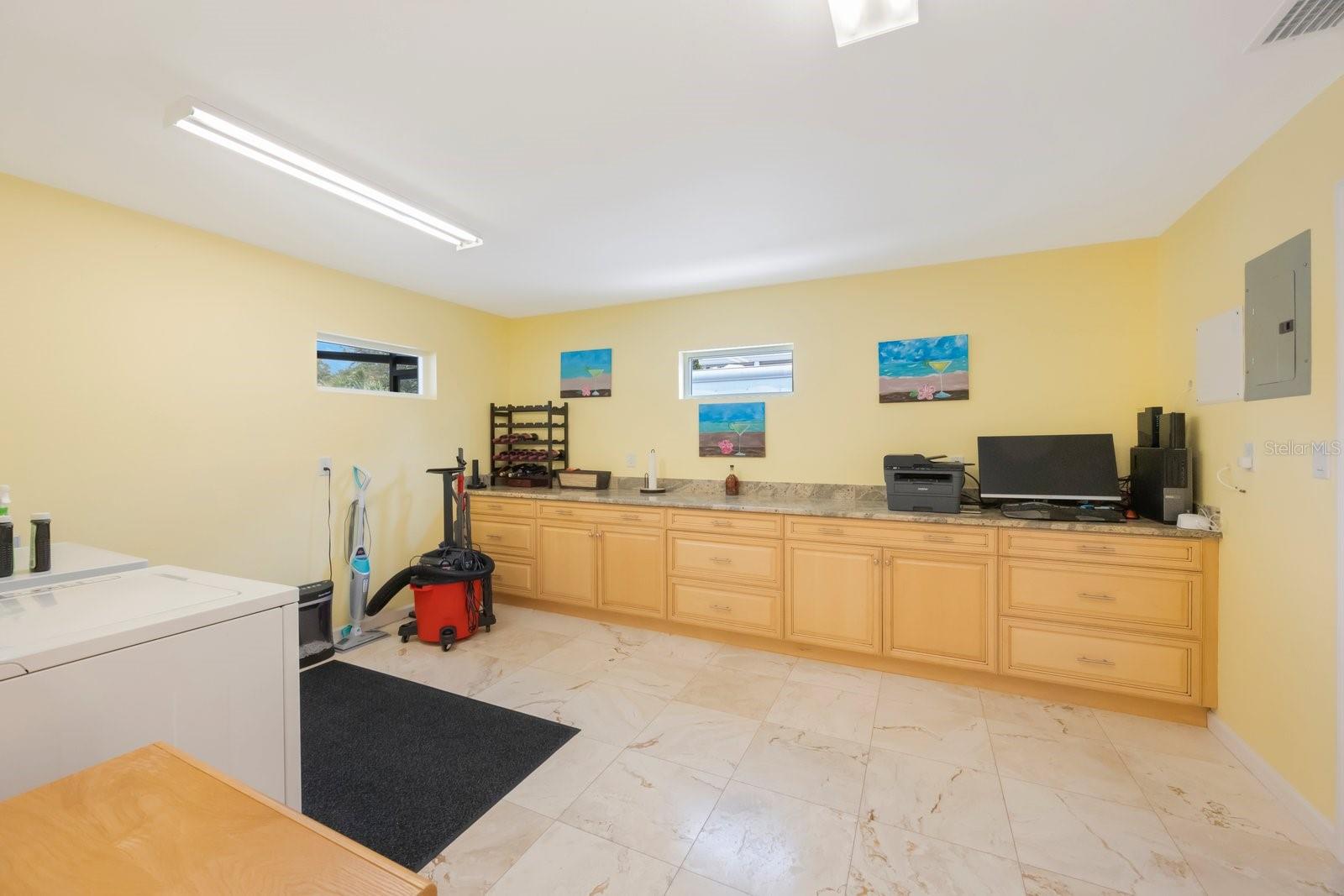 Spacious laundry room offering flexibility for additional uses.