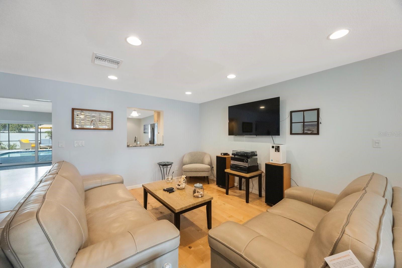The open and airy great room is enhanced by a charming, dedicated cozy corner.
