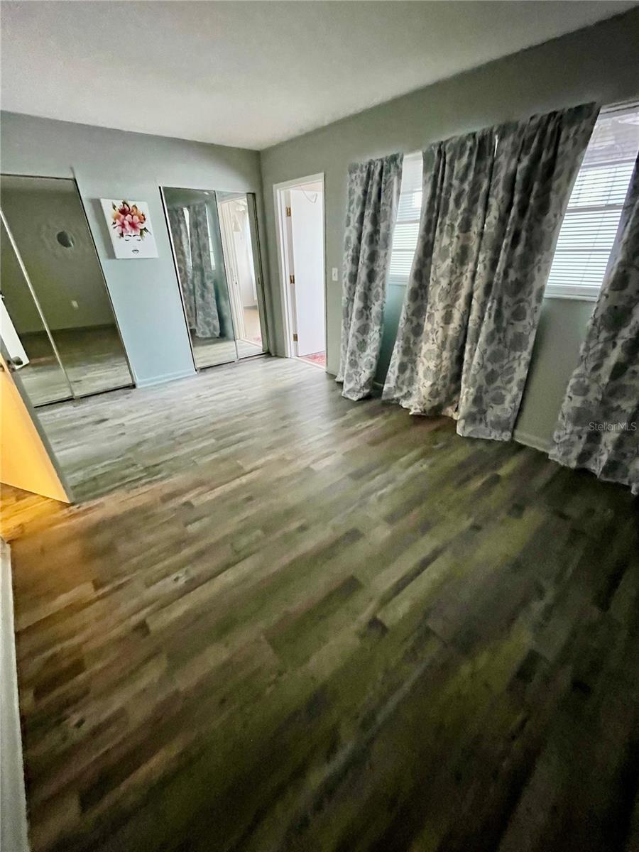 Bedroom - good size, mirror doors on the wall to wall closet. This condo has a good amount of storage