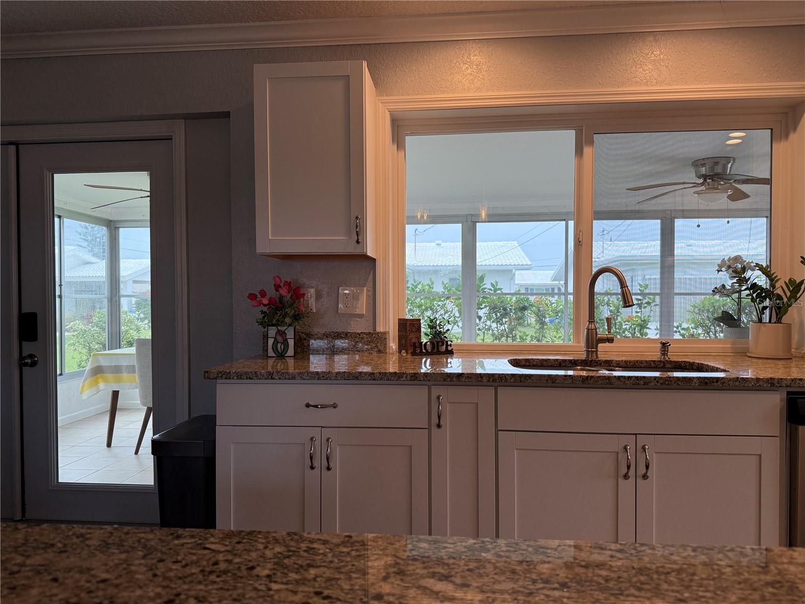 Kitchen with pass thru window to back porch