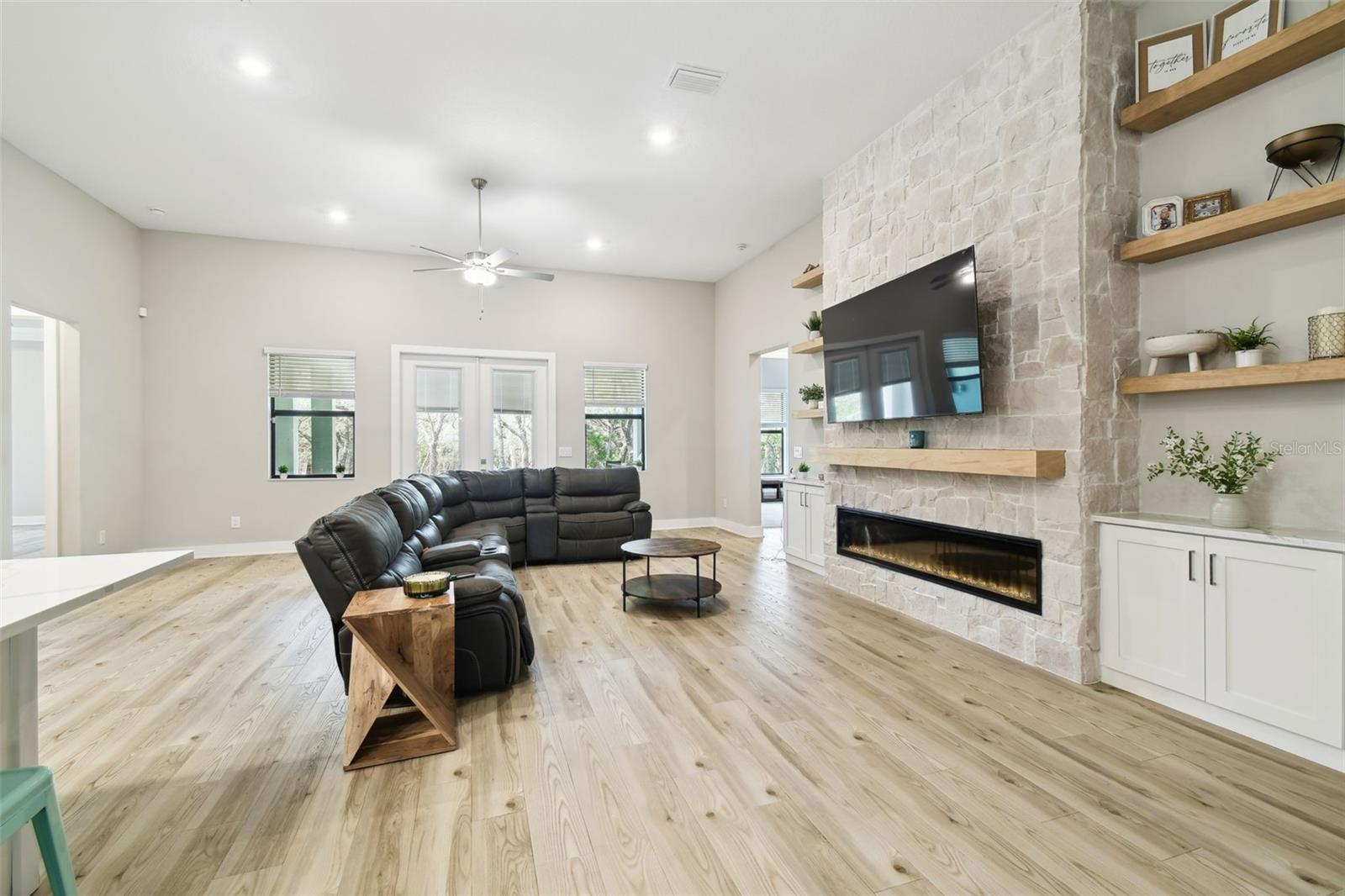Family Room w/Custom Fireplace, Mantle, & Stone Wall