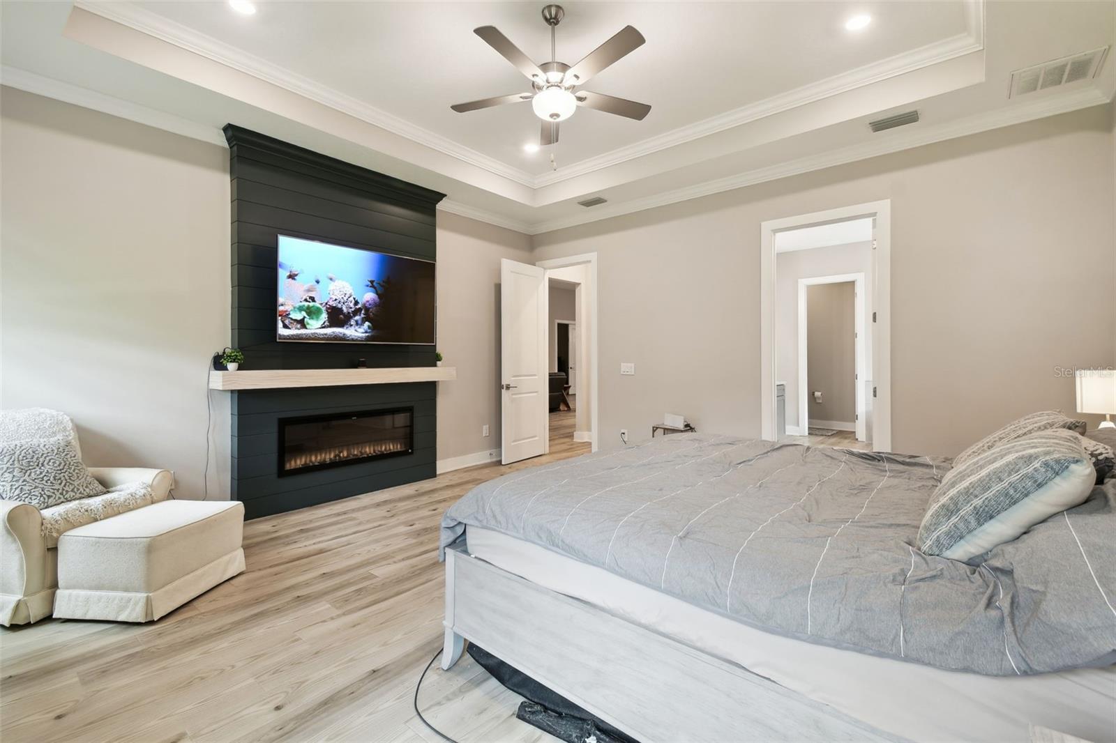 Primary Bedroom w/Electric Fireplace & Dramatic Shiplap Wall Feature