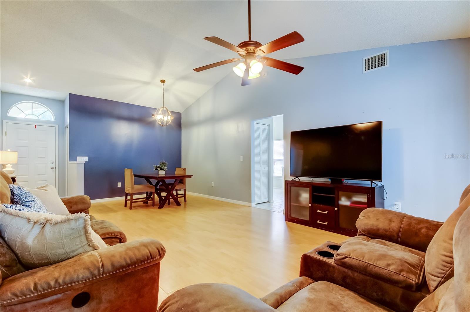 Living/Dining room combo with laminate wood flooring