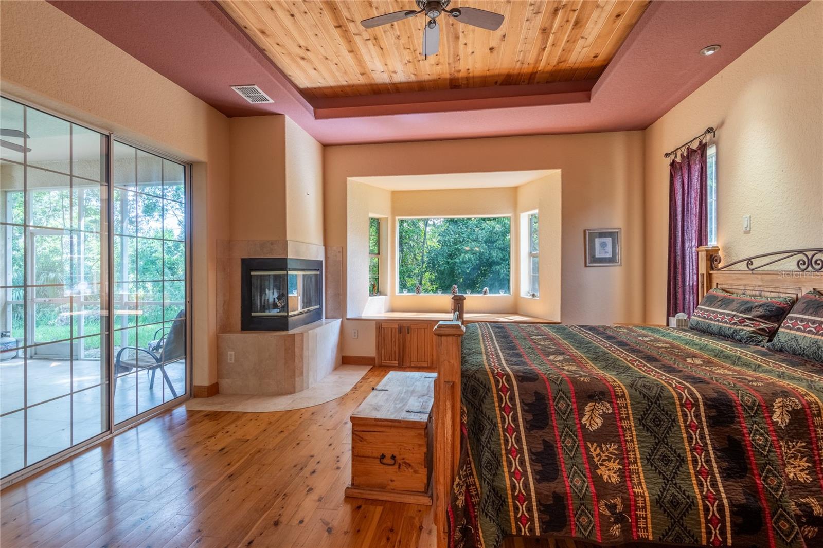Master bedroom with a private fireplace.
