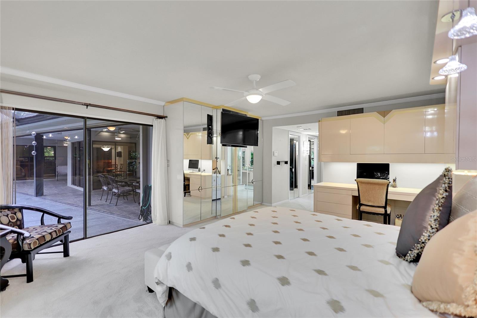 Primary bedroom - opens to pool deck