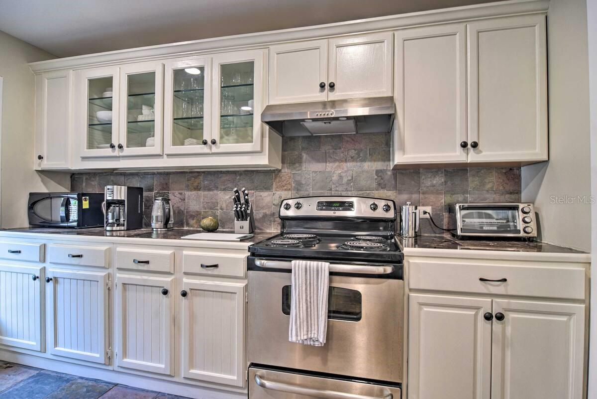 Kitchen with upper original cabinets