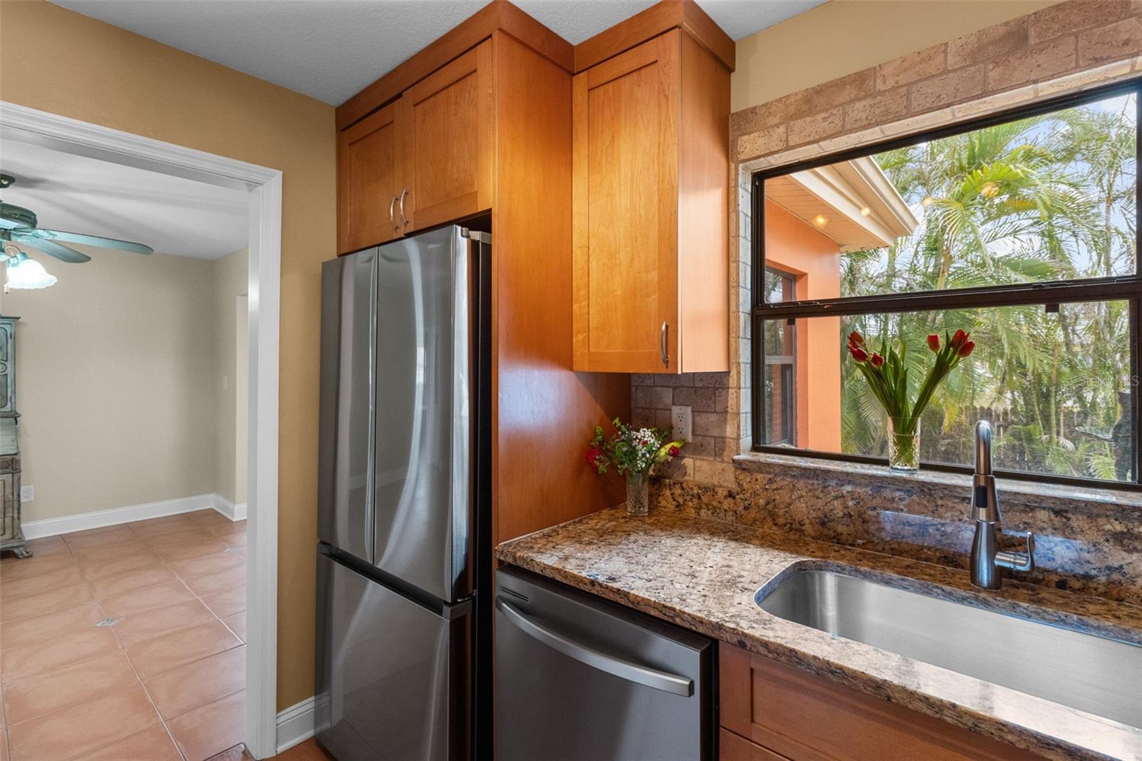 Perfect combonation of style and function in this Gallley kitchen with Matching Stainless Appliances and a Induction cooktop. 819 Gulf Blvd, a charming 2-bedroom, 1-bath ranch-style quaint Bungalow located just steps from beach access on the stunning shores of Indian Rocks Beach, Indian Rocks Beach Nature Preserve with public dog park and a Boardwalk to through the Mangroves on the Intercoastal.