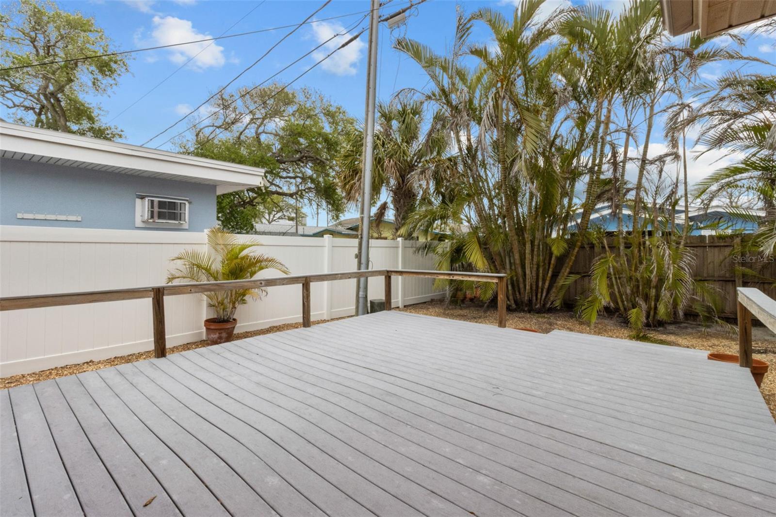 Enjoy your back yard oasis with this easy to maintain oversized composite deck  819 Gulf Blvd, a charming 2-bedroom, 1-bath ranch-style quaint Bungalow located just steps from beach access on the stunning shores of Indian Rocks Beach, Indian Rocks Beach Nature Preserve with public dog park and a Boardwalk to through the Mangroves on the Intercoastal.