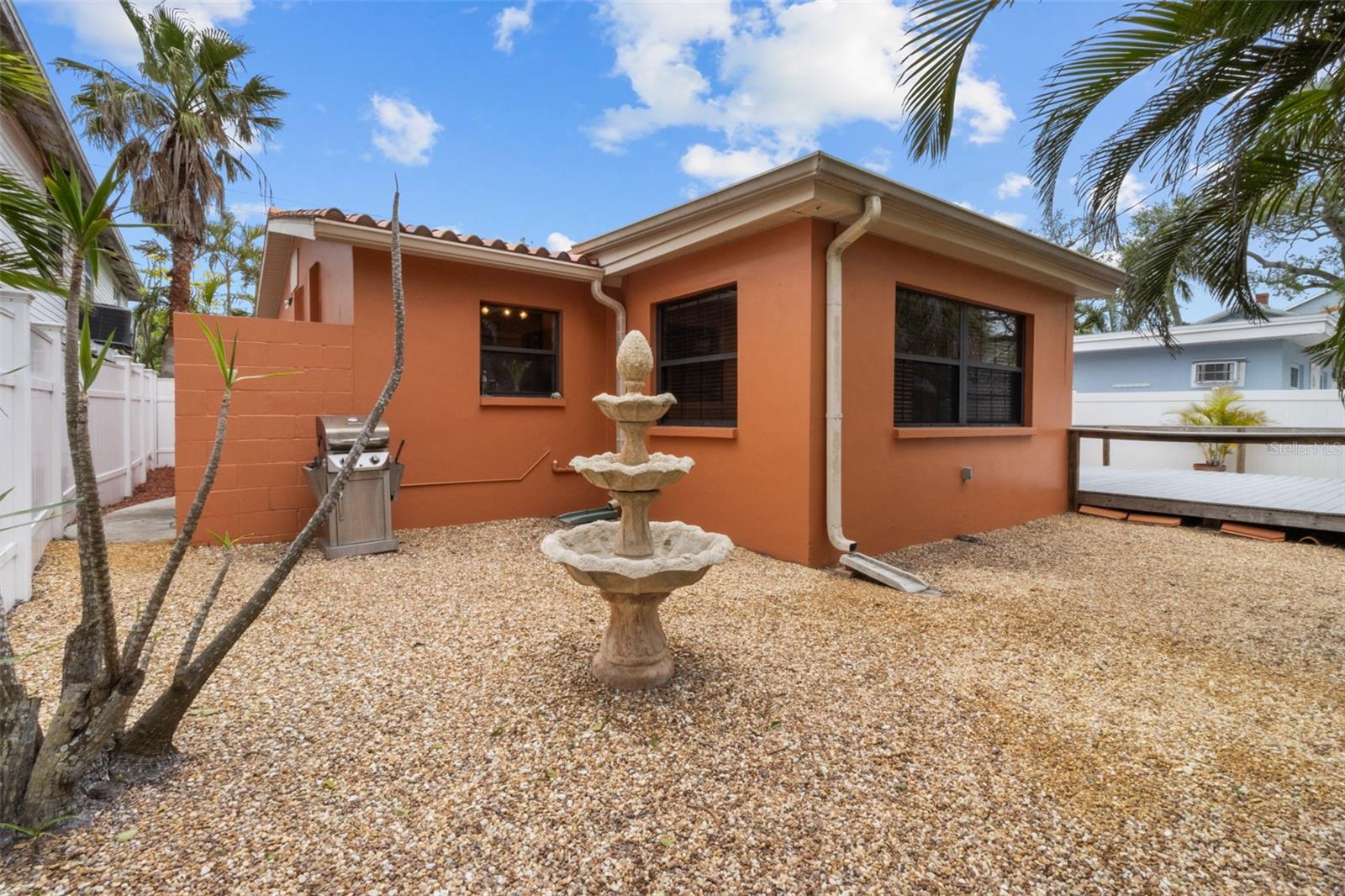 Enjoy your back yard oasis with this easy to maintain oversized composite deck  819 Gulf Blvd, a charming 2-bedroom, 1-bath ranch-style quaint Bungalow located just steps from beach access on the stunning shores of Indian Rocks Beach, Indian Rocks Beach Nature Preserve with public dog park and a Boardwalk to through the Mangroves on the Intercoastal.