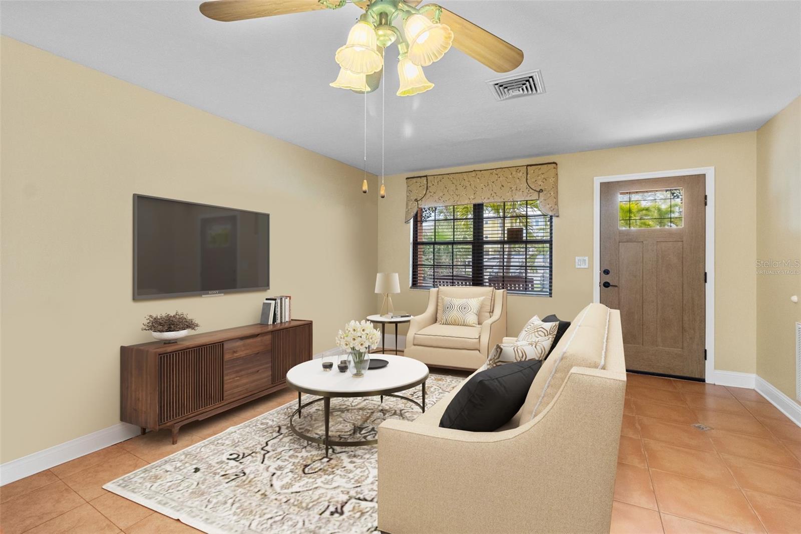 Virtually staged family room showing the possibilities of bringing your touch and style to make this home your masterpiece. 819 Gulf Blvd, a charming 2-bedroom, 1-bath ranch-style quaint Bungalow located just steps from beach access on the stunning shores of Indian Rocks Beach, Indian Rocks Beach Nature Preserve with public dog park and a Boardwalk to through the Mangroves on the Intercoastal.