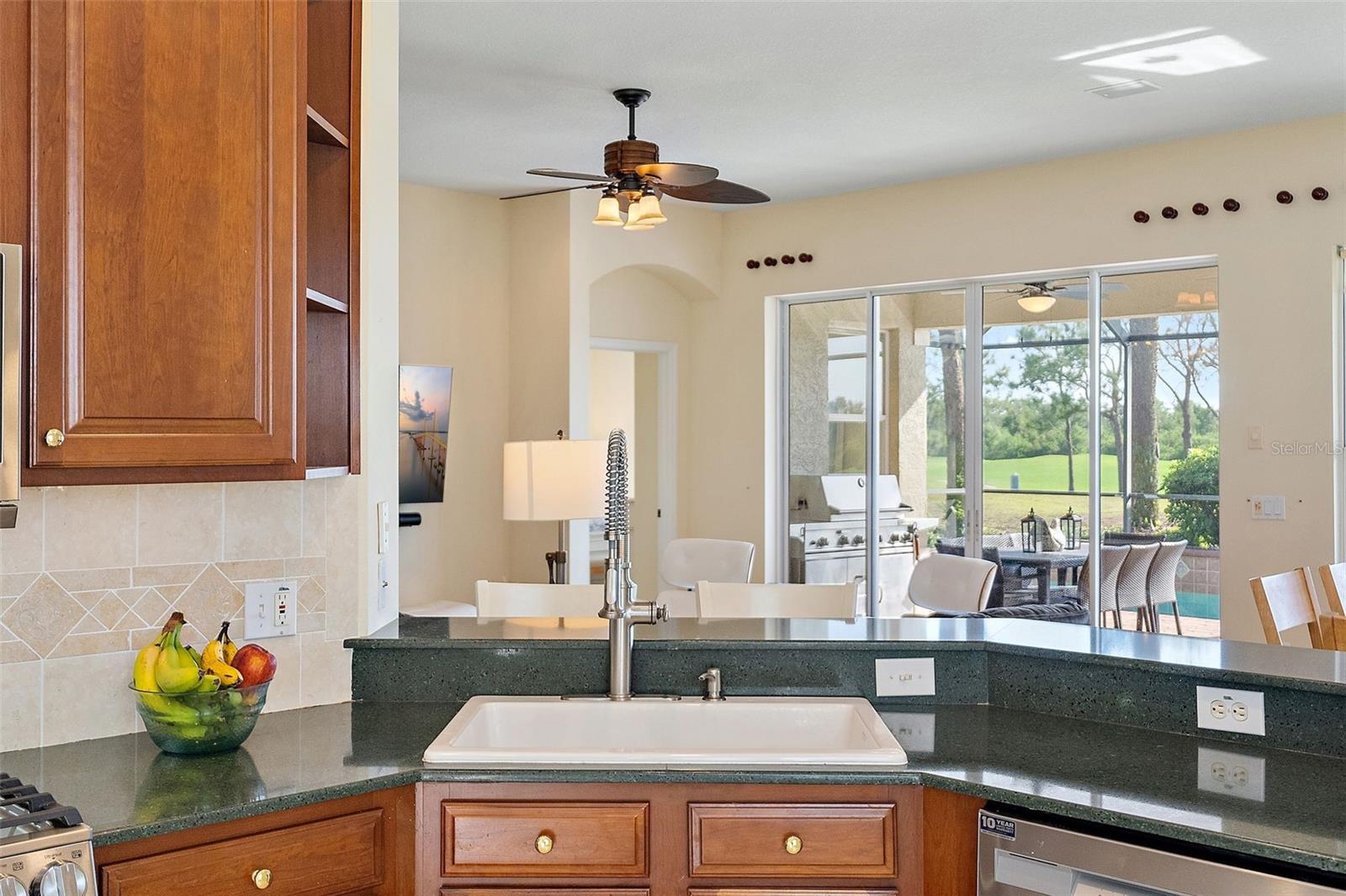 Granite Countertop, Tile Backsplash, Wood Cabinetry w/Plenty of Outlets