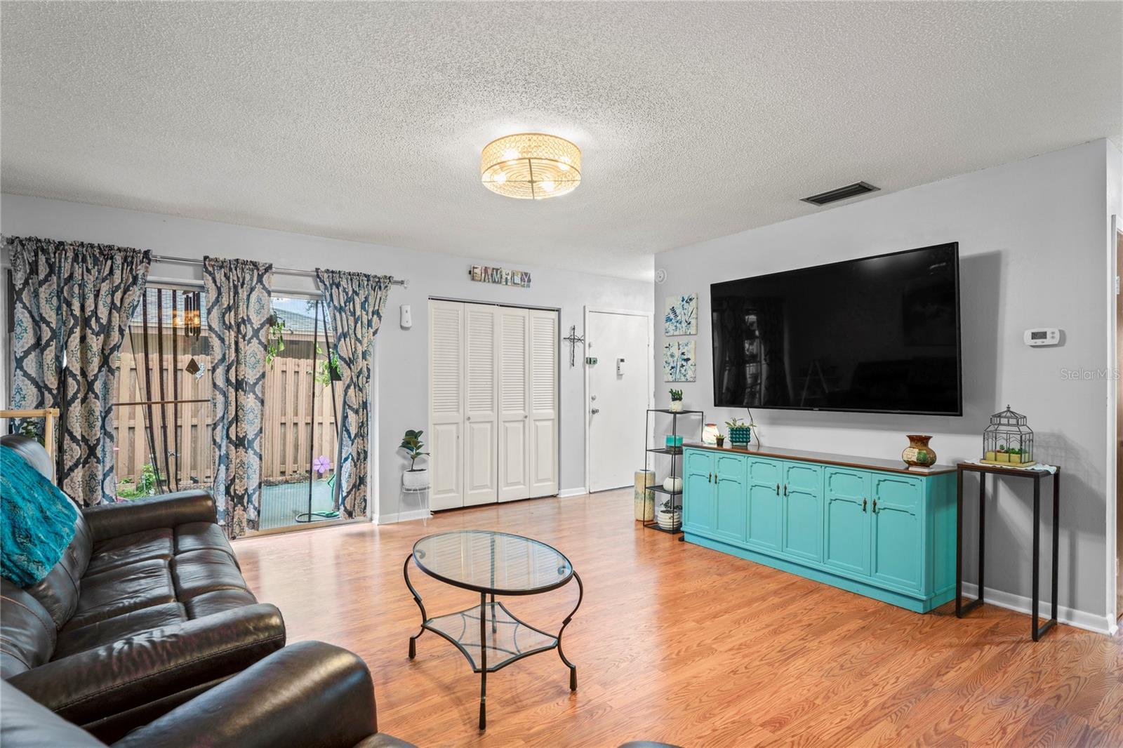 Living Room looking towards front door and sliding glass door