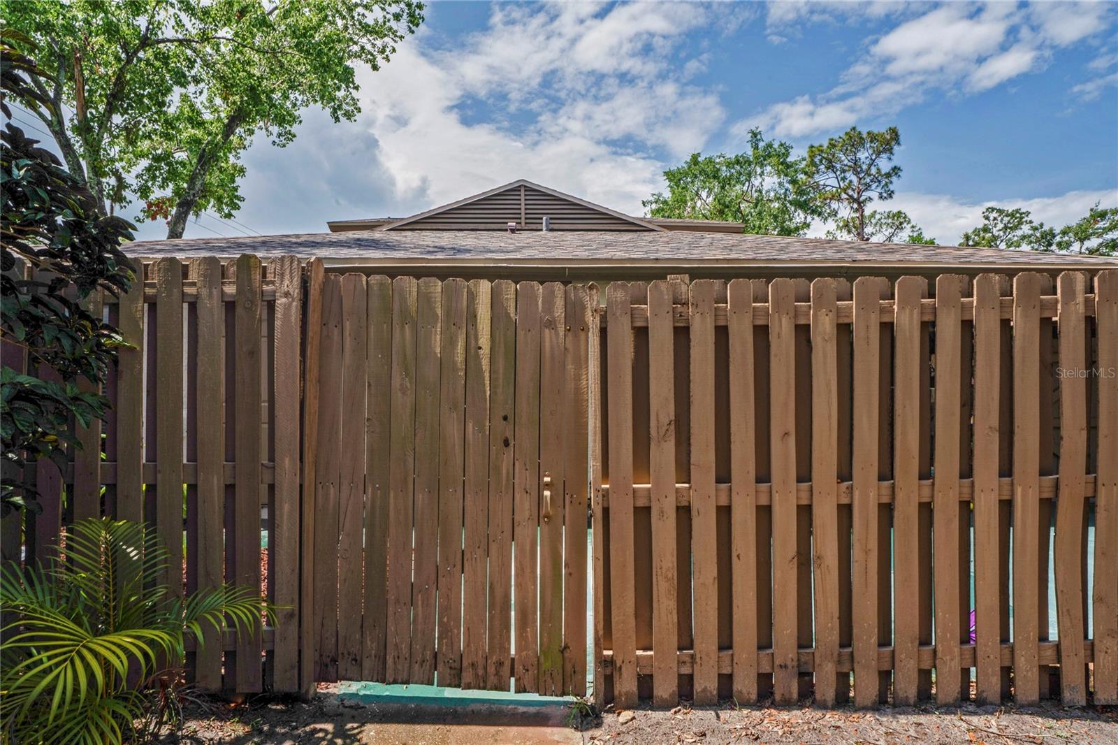 One of 3 private entryways to side yard/patio