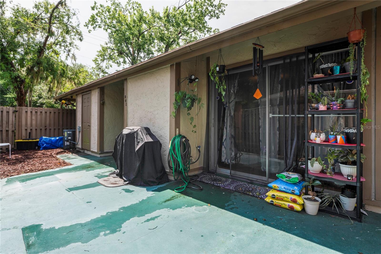 Spacious and Private Side Yard looking at sliding glass door