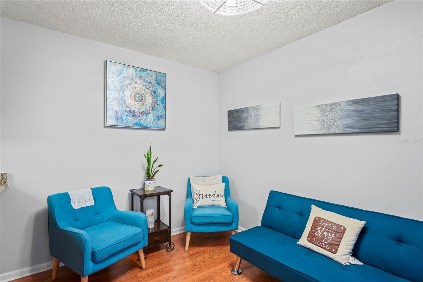 Dining Area currently staged as a den or extra living room space