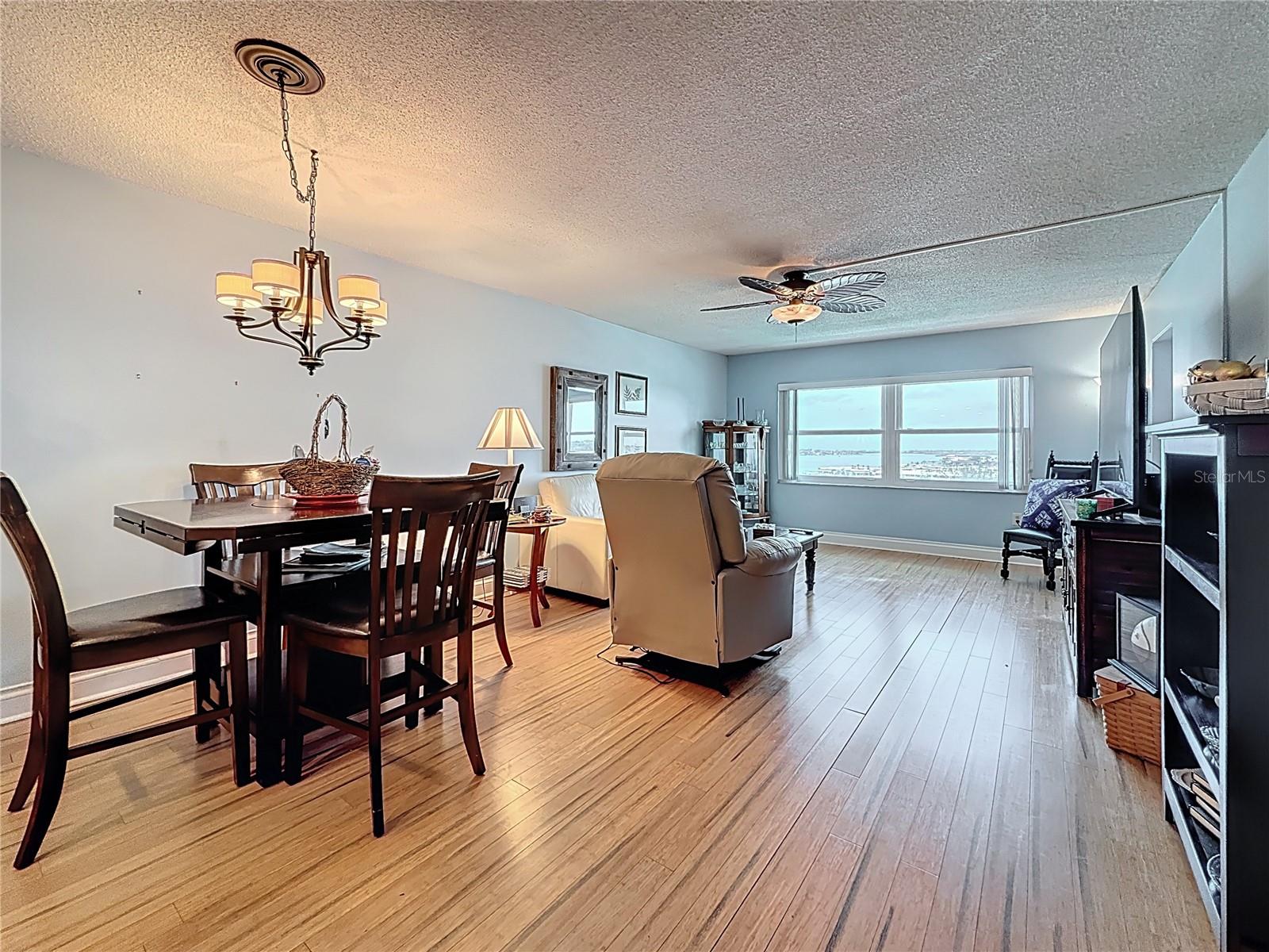 Take a look at how spacious the dining and living area is with beautiful views of the water.